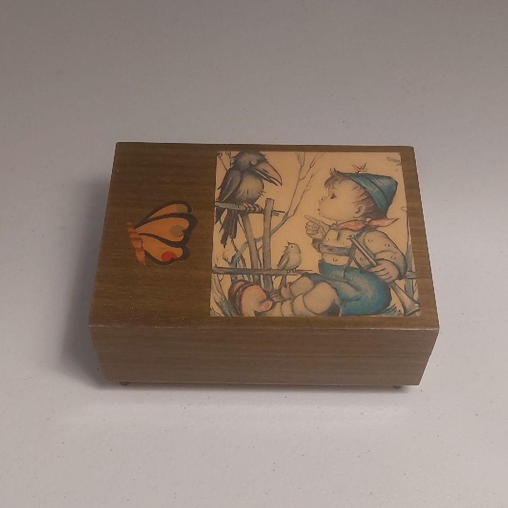Vintage Wooden Music Box with Child and Bird Illustration